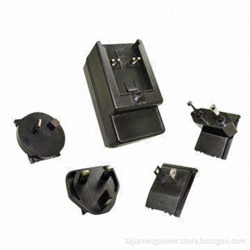 AC/DC Switching Adapter with Fixed and Interchangeable Plugs